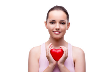 Young woman with red heart isolated on white