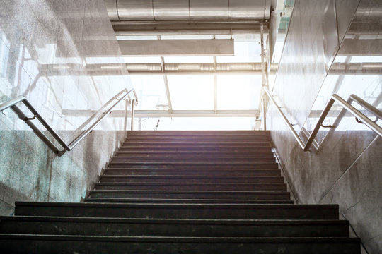 stairs in metro, way up, urban concrete interior