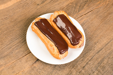 Beautiful homemade mini eclairs filled with vanilla and chocolat