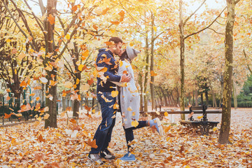 couple kissing in autumn park, fall