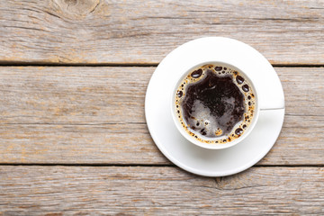 Cup of coffee on a grey wooden table