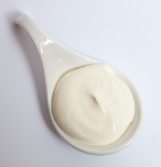 cream sauce in white bowl on a light background