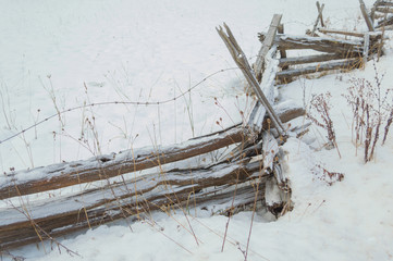 Zig zag rustic cedar rail fence with snow dusting