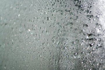 Drops of water on wet window.