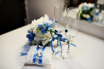 Wedding rings, goblets, flowers and accessories