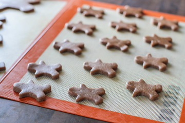 Laying down ginger bread and figurines ready for the owen