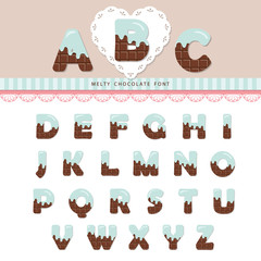 Blue cream melted on chocolate decorative alphabet. Cute ABC letters can be used for bitrhday card, Valentines day, sweets shop, girls magazine. Isolated.