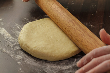 Rolling our fresh biscuit dough on the table