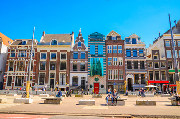 Traditional old buildings and and boats in Amsterdam, Netherlands