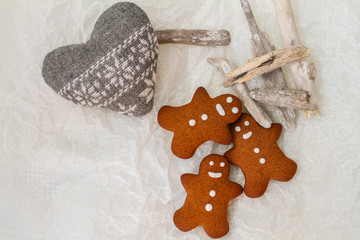 Three Gingerbread man cookies on tha table