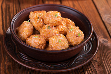 Meatballs with tomato sauce in a ceramic bowl