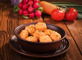 Meatballs with tomato sauce in a ceramic bowl