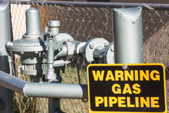 Gas pipeline near a chain link fence