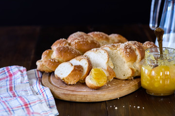 Challah bread on wooden table