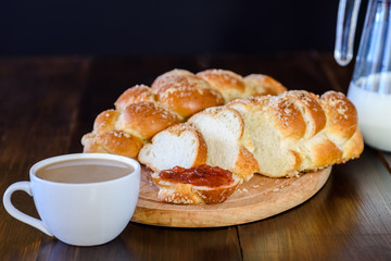 Challah bread on wooden table