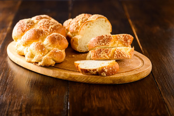 Challah bread on wooden table