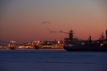 Fototapeta premium Saint-Petersburg winter background with frozen Neva river and morning sky.