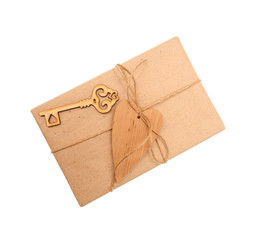 box of kraft paper and wooden heart on white background