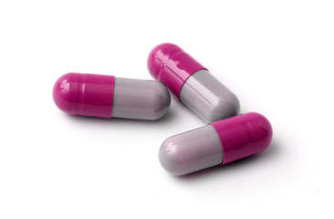 Three Pills Isolated on a White Background