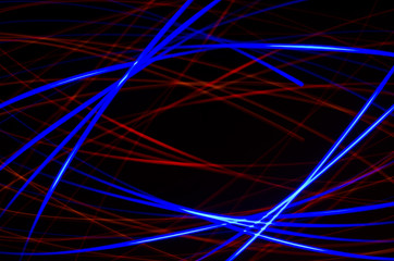 Light spiral, red and blue lines on a black background
