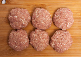 raw meatballs on board