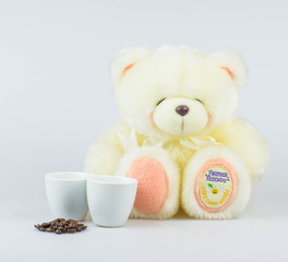 Happy valentines day greeting card with teddy and espresso coffee