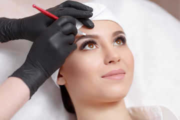 Permanent makeup eyebrows.