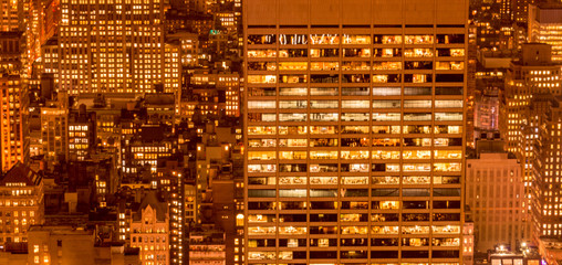 Office windows illuminated at night