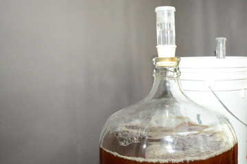 Home brew glass carboy filled with beer
