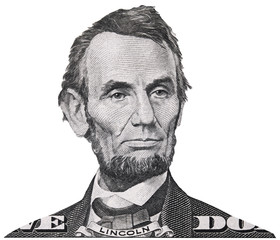 US president Abraham Abe Lincoln face portrait on USA 5 dollar bill closeup isolated, United States...
