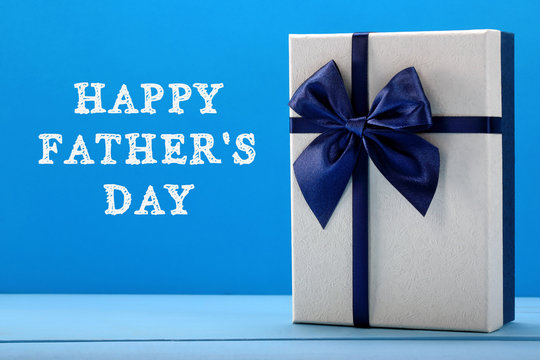 Blue gift box with Happy Fathers Day inscription greetings