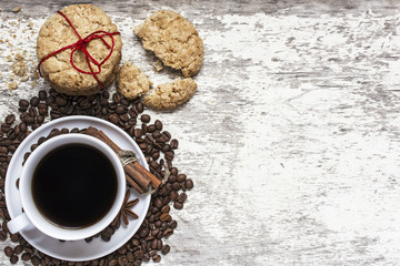 cup of coffee and homemade cookies tied with red ribbon