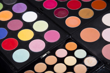 Obraz na płótnie Canvas colorful eyeshadow palette and blush for make-up closeup