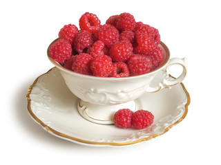 Fresh raspberries and white porcelain set