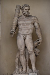 Fototapeta na wymiar Hercules statue on the facade of the Ducal Palace, Modena, Italy