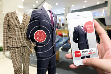 smart retail and ibeacon marketing concept. Hand holding smart phone use bluetooth and application to check number of social media like and sale price in retail fashion shop