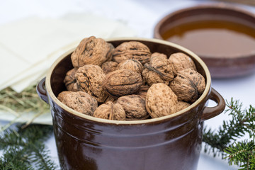 Walnuts in a ceramic pot