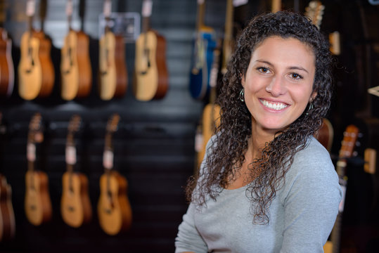 Portrait of woman in guitar shop
