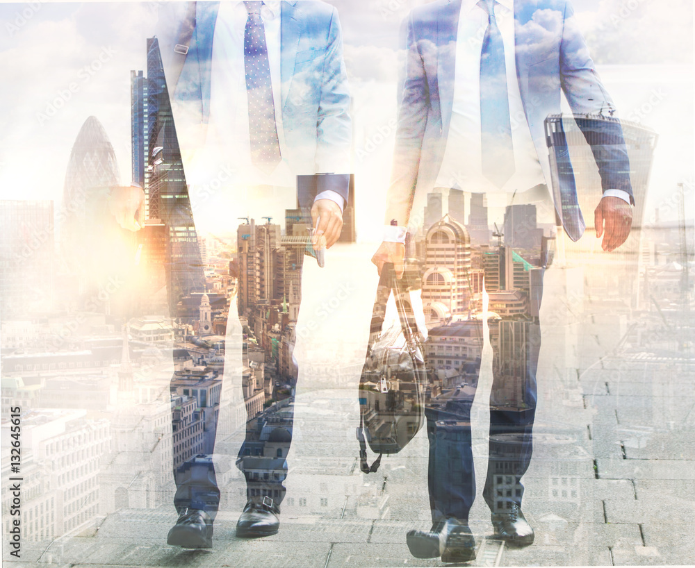 Poster Two young businessman in suits walking in the City. Business and modern life concept 