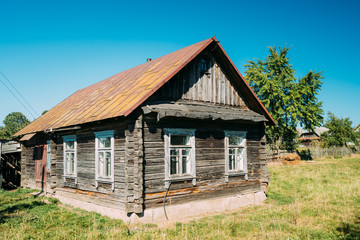 Fototapeta na wymiar Old Russian Traditional Wooden House In Village Of Belarus Or Ru