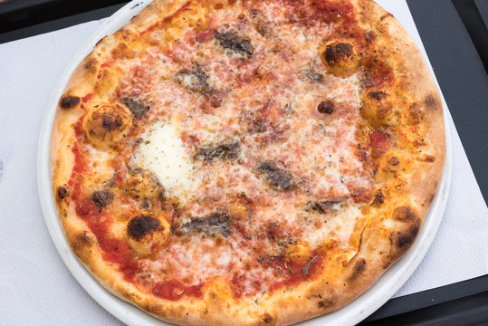Tasty Italian pizza with anchovies