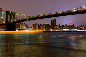 Naklejka premium Brooklyn Bridge at dusk viewed from the Park in New York City.