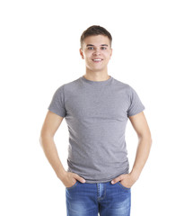 Handsome young man in blank grey t-shirt on white background