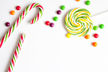 sweets and sugar candies on white background top view