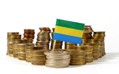 Gabon flag waving with stack of money coins