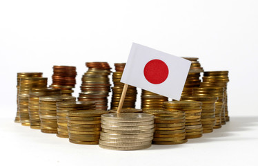 Japan flag waving with stack of money coins