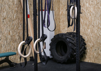 Gymnastic rings suspended on straps in gym