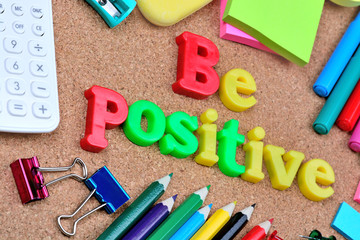Be positive word on cork background