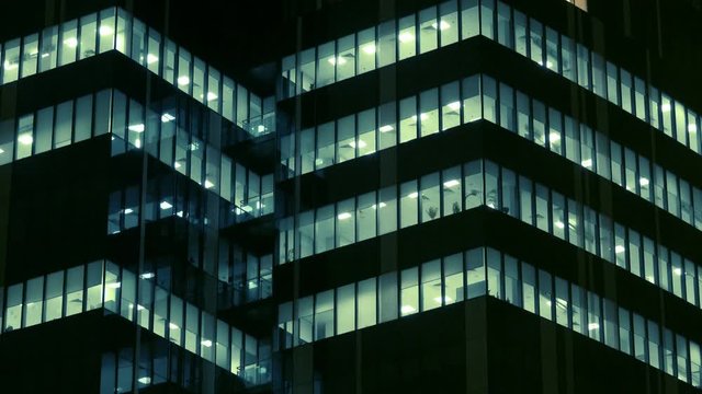 Glass business office building at night