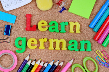 Learn german words on cork background
